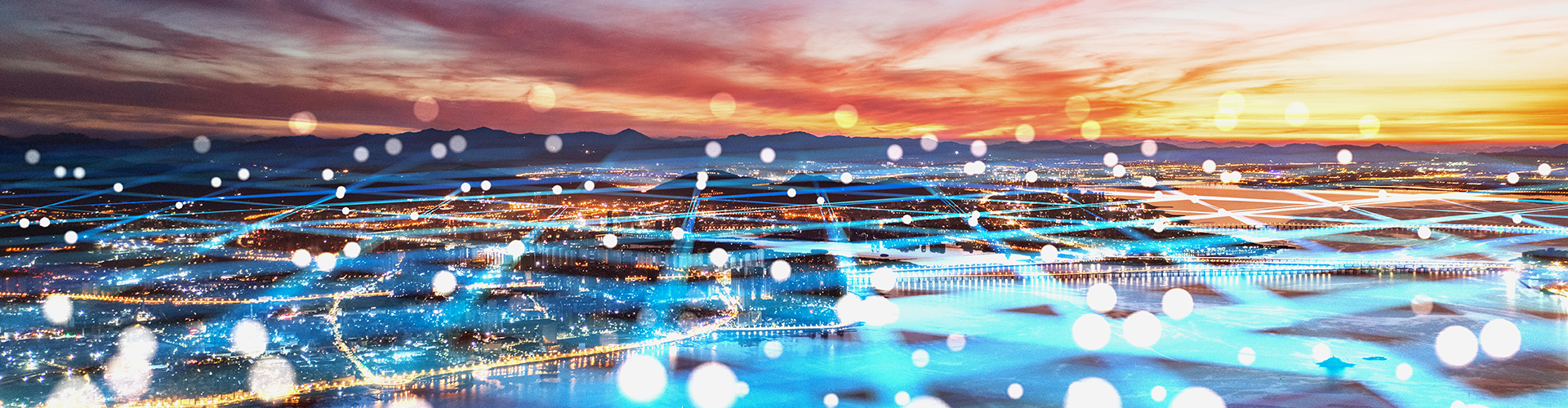 View over waterfront city at sunset