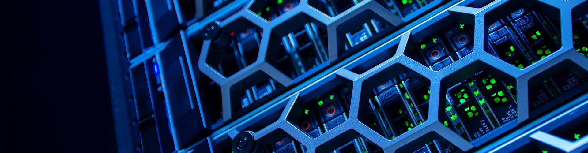 Close-up of a data center server rack with hexagonal metal grilles